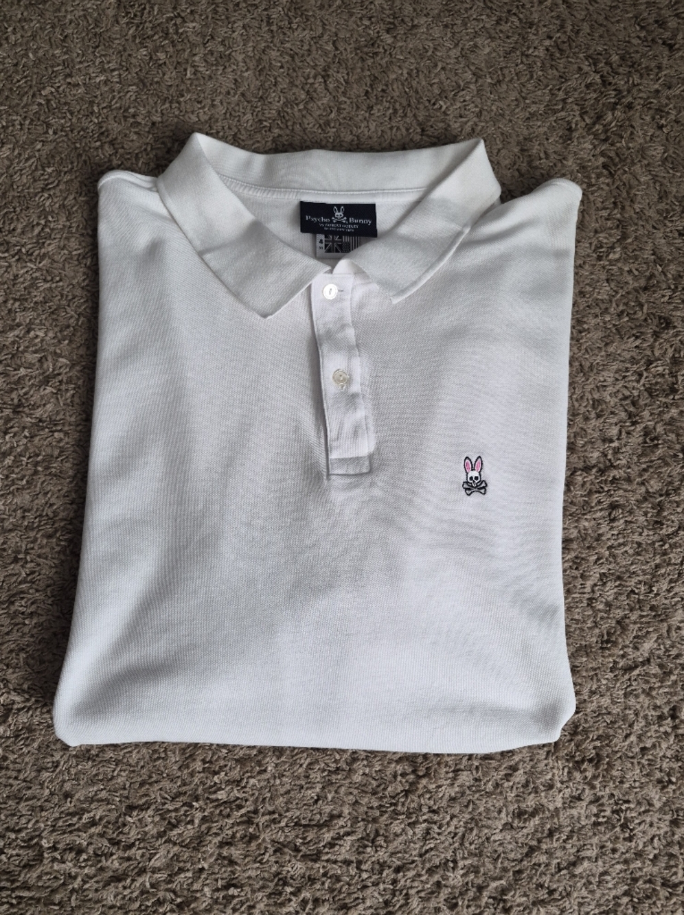 Psycho Bunny White Polo with Pink Accent Logo
